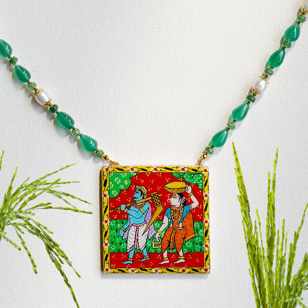 Front View of Rustic Roots folk necklace by Bujjis with hand-painted village scene pendant, emerald, onyx, and pearl detailing.