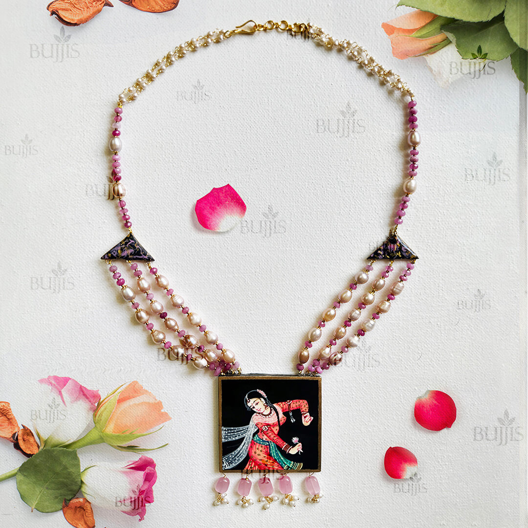 Front View of Motion Elegance necklace by Bujjis featuring hand-painted Nirmal dancer pendant with jade, pearls, and golden accents.