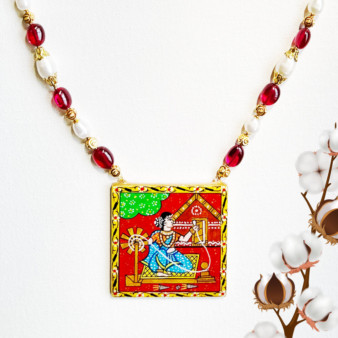 Front View of Weaver Tale Telangana heritage necklace with rubies, pearls, and hand-painted weaver art in a red and gold frame by Bujjis