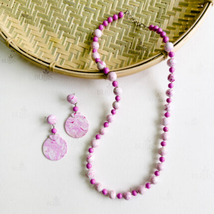 Blush Marble necklace and earring set by Bujjis with soft pink and white marbled polymer clay beads and elegant swirling patterns.
