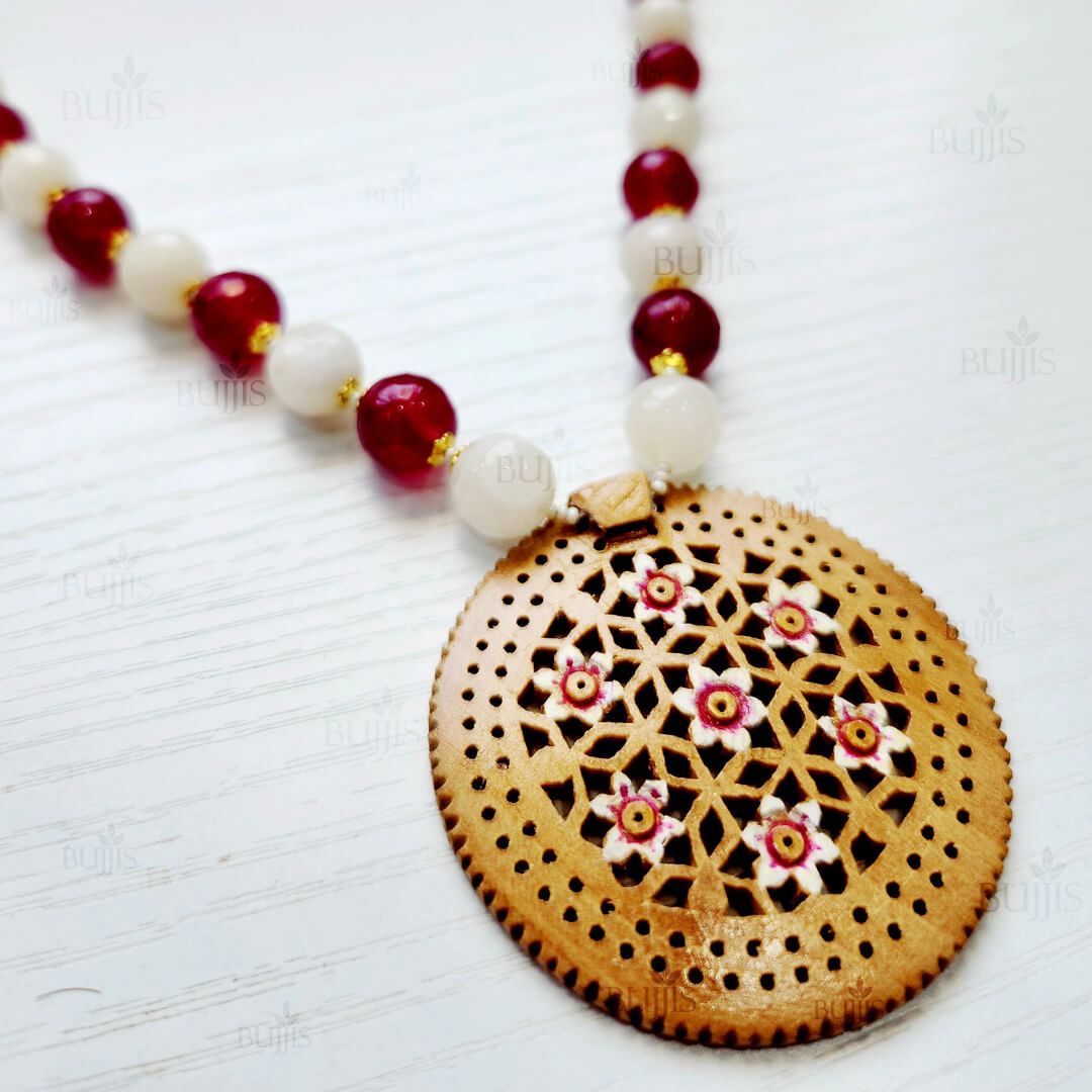 Timber Bloom Necklace & Earring Set by Bujjis, carved wooden pendant with floral motifs and vibrant beads.