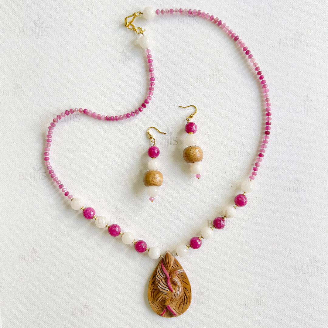Rose Wings Necklace & Earring Set with wooden swan pendant, pink and white beads, and golden accents.