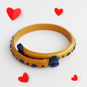 Star Braid gold polymer clay bangle with navy braided texture and hand-painted star details – handmade by Bujjis.in