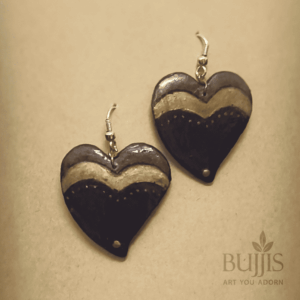 “Handcrafted black and gold heart-shaped polymer clay earrings by Bujjis, perfect minimalist accessory.”