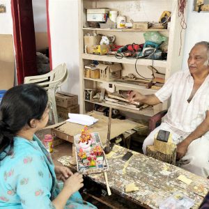 Skilled artisan handcrafting intricate wearable Indian art jewellery at Bujjis